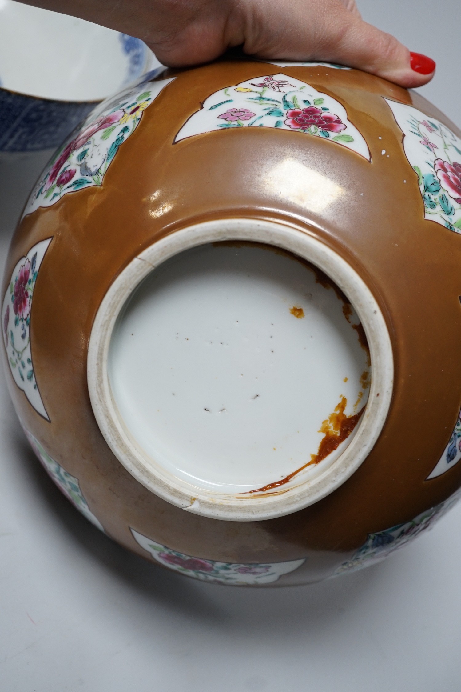 A group of Japanese and Chinese ceramics to include two blue and white jars, a wucai bowl etc.